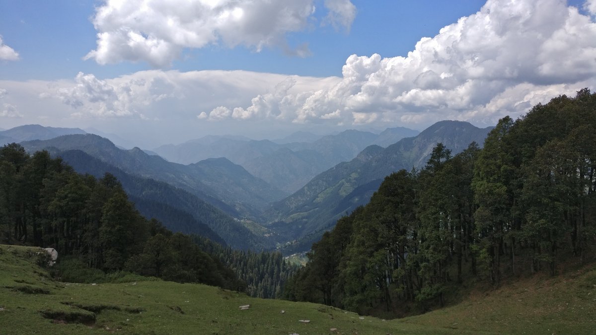 Mountain ridges and forested valleys of the Great Himalayan National Park seen from near Jalori Pass