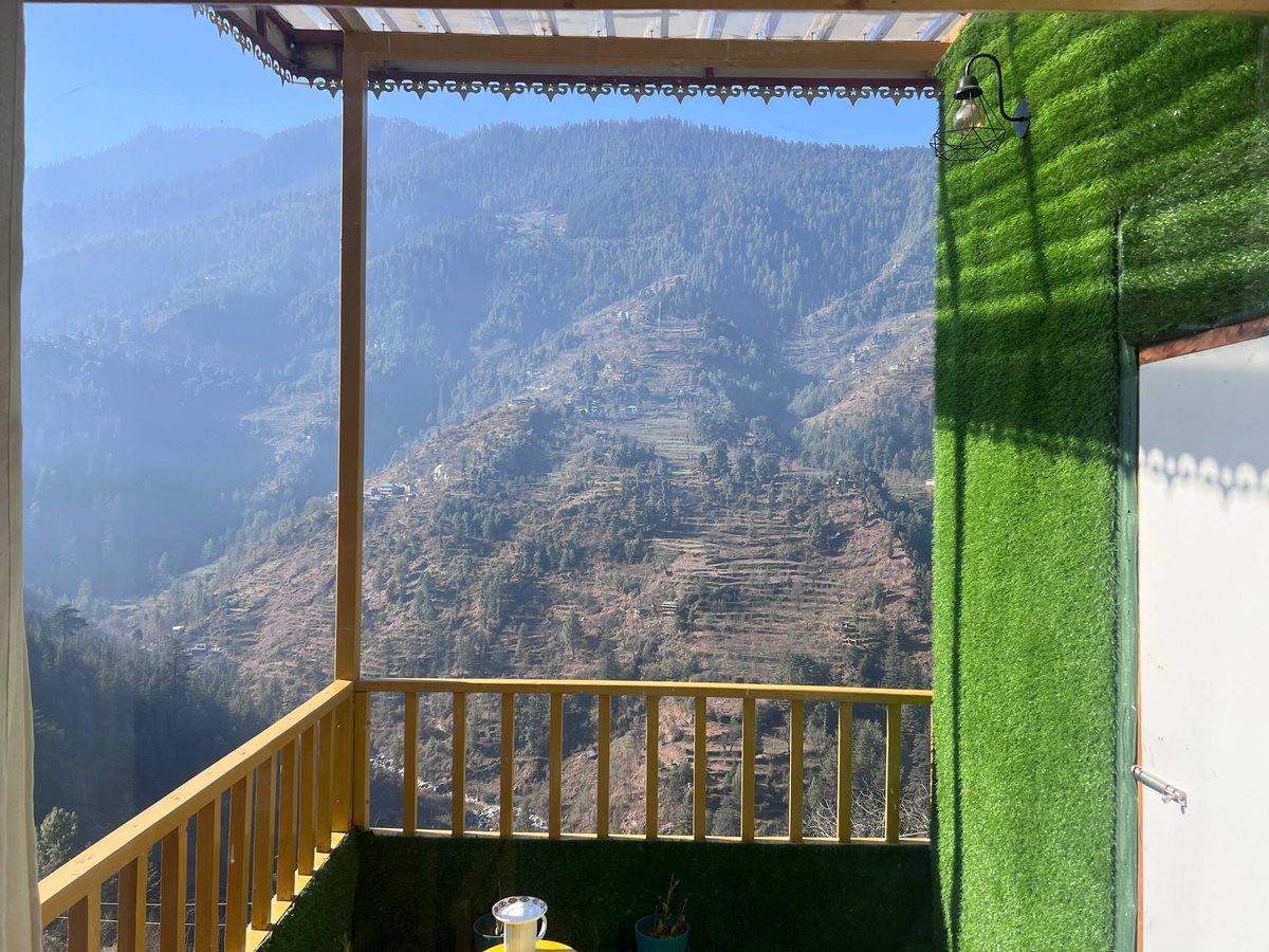 Valley view from the Glass House balcony at Peaks N Valley Stays in Chhet, near Jibhi