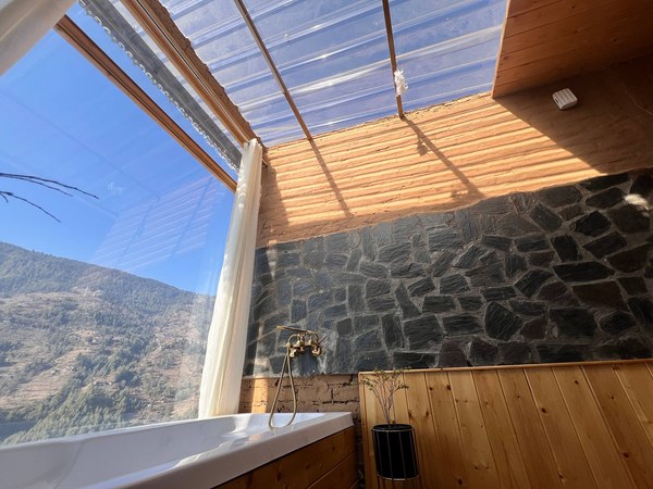 Hot tub under the glass roof